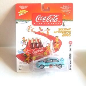 2005 Johnny Lightning Coca Cola Holiday Automents 2003 Mitsubishi Lancer